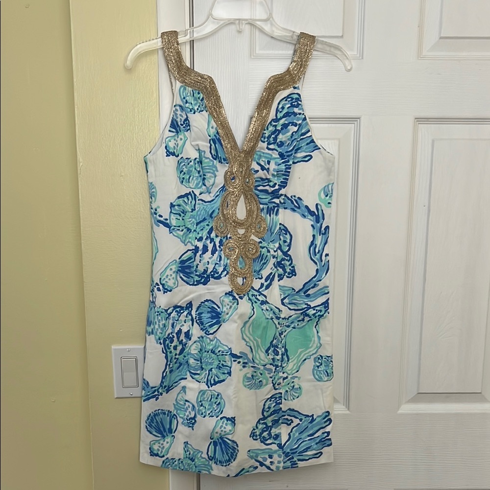 Blue sleeveless sundress with plunge neckline for resort wear